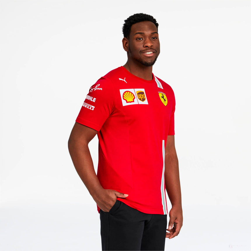Model wearing red Ferrari polo shirt with logos