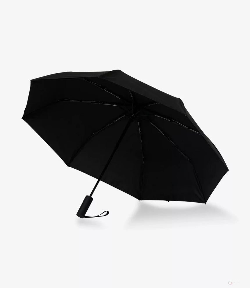 Black open umbrella with handle and wrist strap