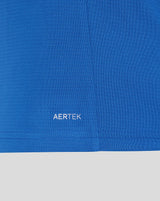 Blue women's polo shirt with AERTEK print on the lower part.